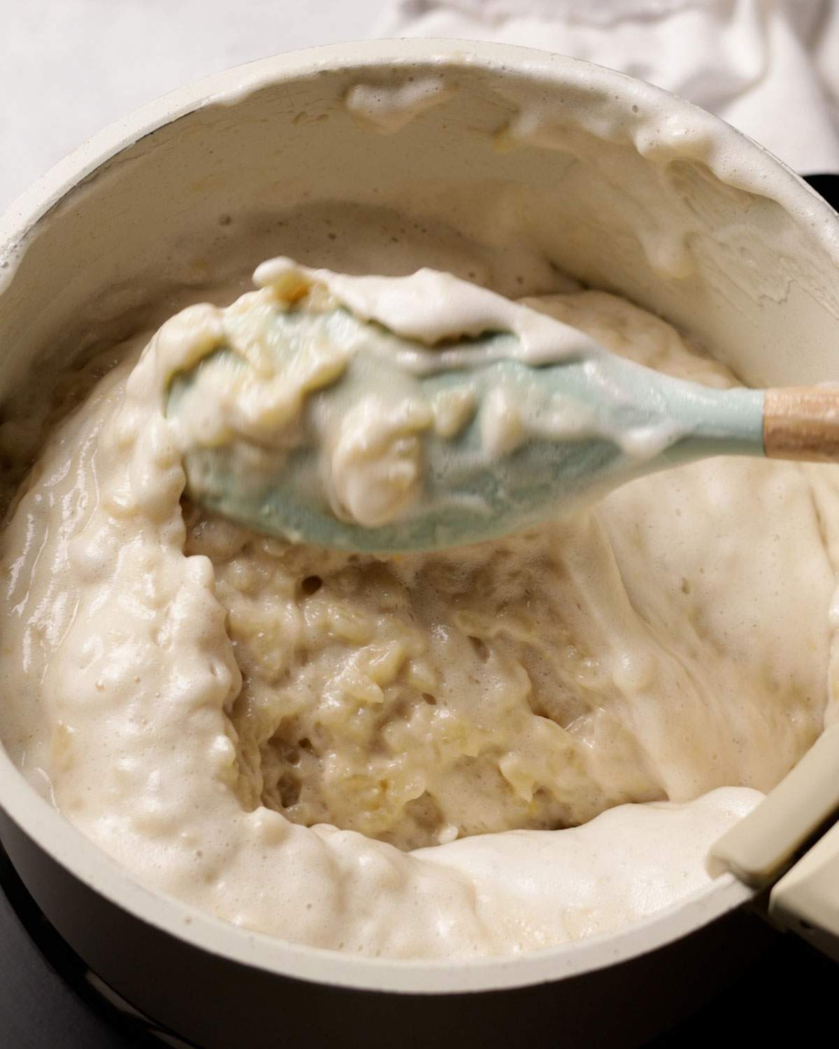 Folding aquafaba into rice pudding mix.