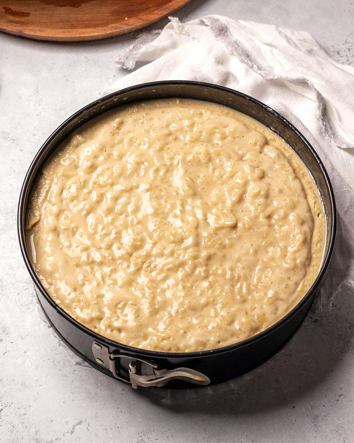 Rice pudding cake in a springform before baking.