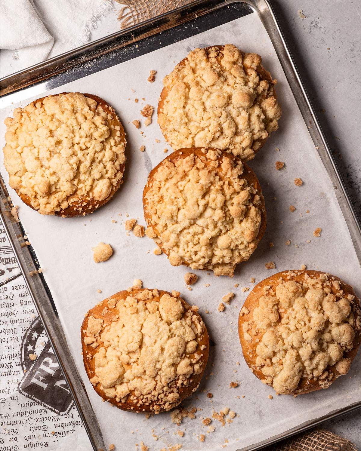 Baked Vegan Streuselbrötchen on a baking tray.