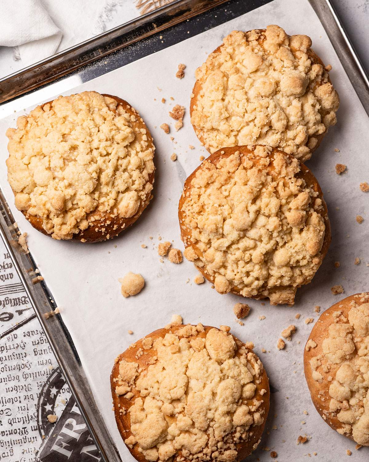 Baked Vegan Streuselbrötchen on a baking tray.