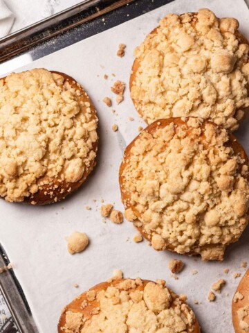 Baked Vegan Streuselbrötchen (crumble rolls) on a baking tray.