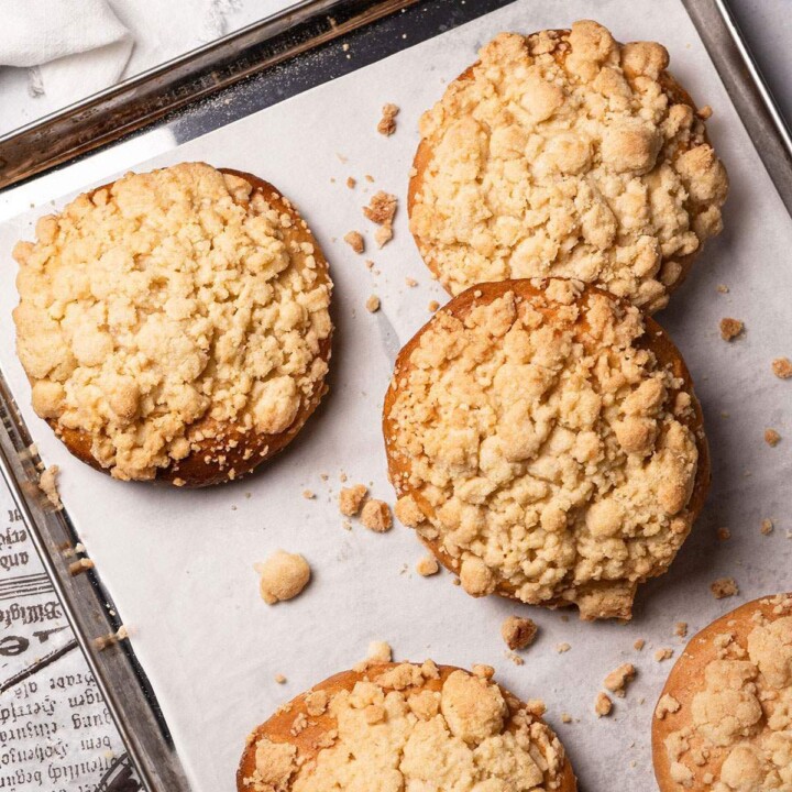 Baked Vegan Streuselbrötchen (crumble rolls) on a baking tray.