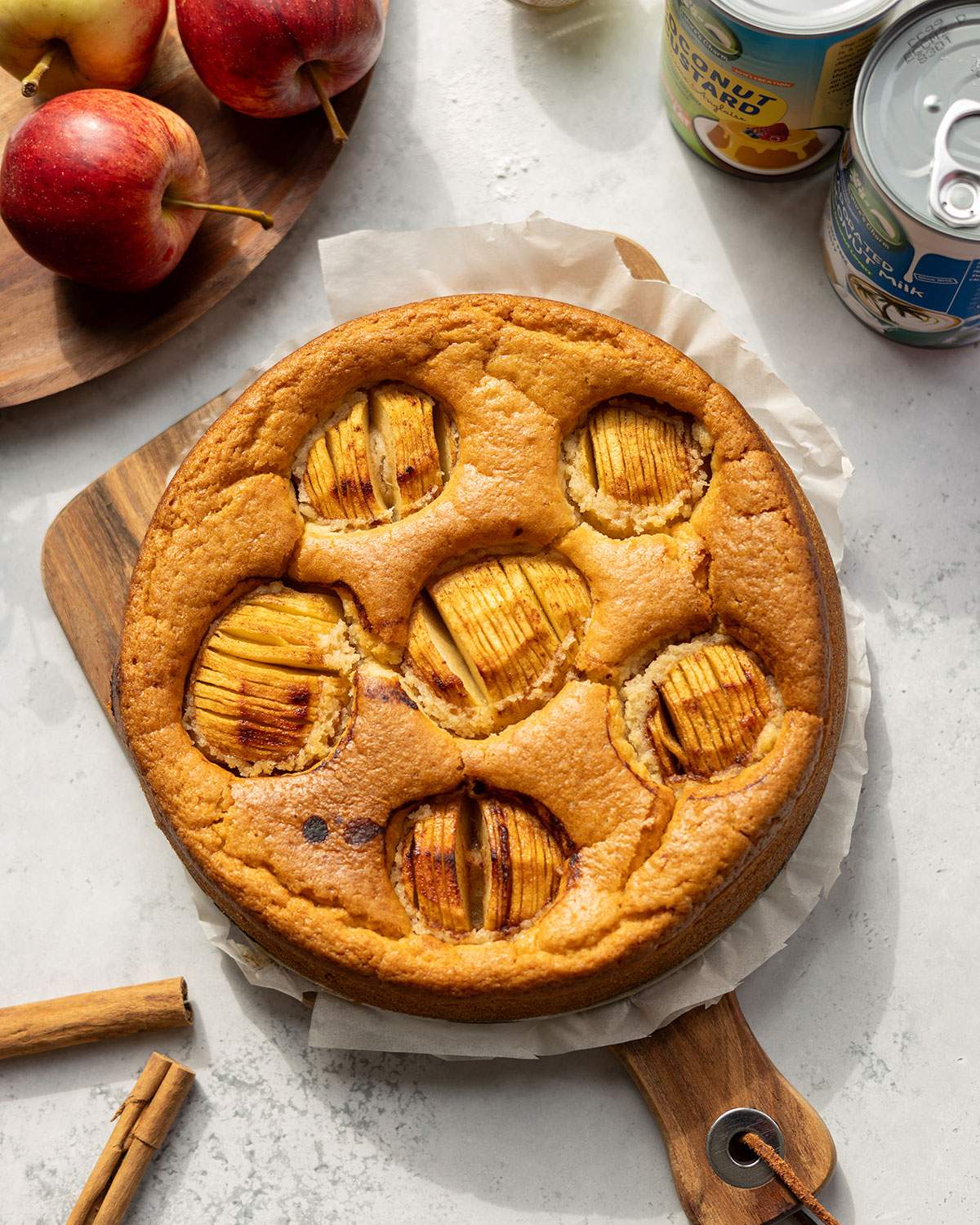 Freshly baked vegan German apple cake topped with baked apples.